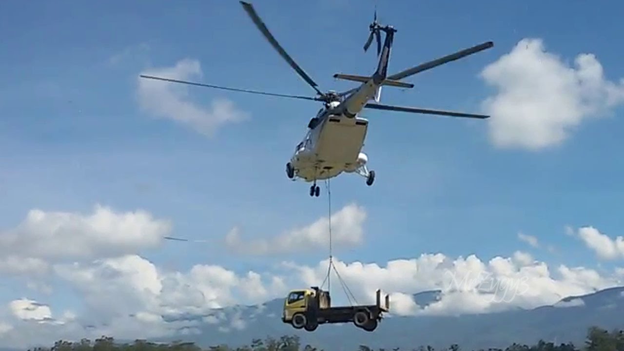 Mi-171 Helicopter Transporting Mitsubishi Fuso Truck