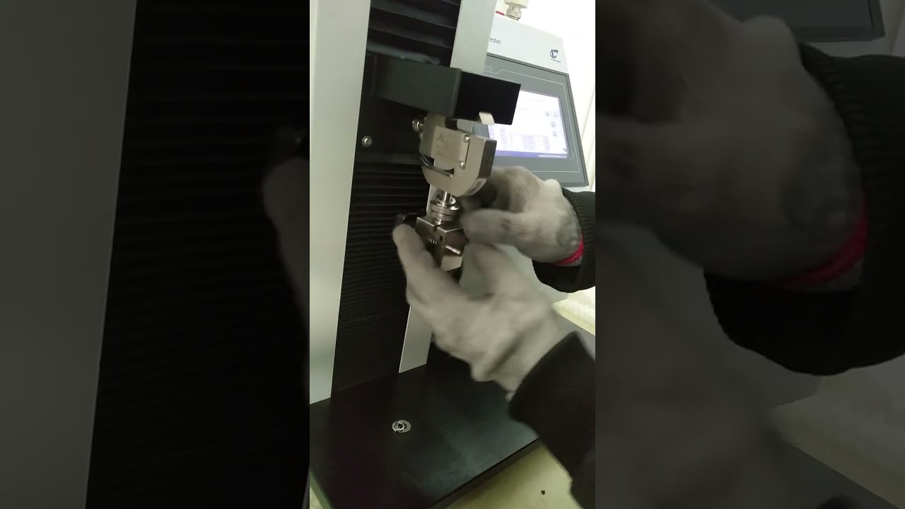 Remove the sample clamp from TST-01 tensile tester