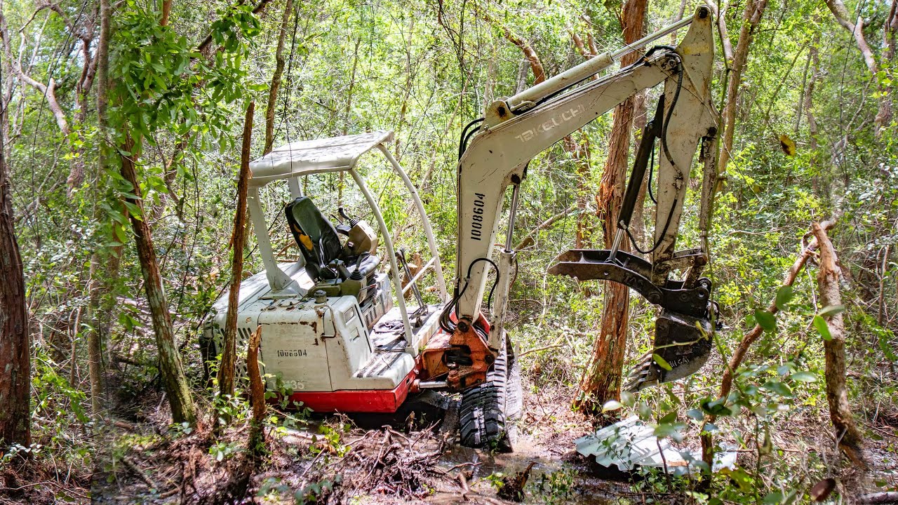 Excavator stuck in a swamp!