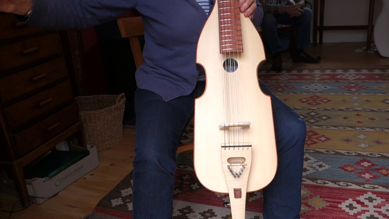 Alan Miller Guitars - bowed guitar with 9 sympathetic strings.