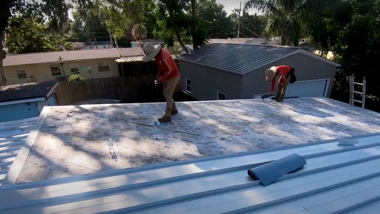 Converting a Flat Modified Roof System into a Tapered ISO-Board System and Seamless Metal Roof