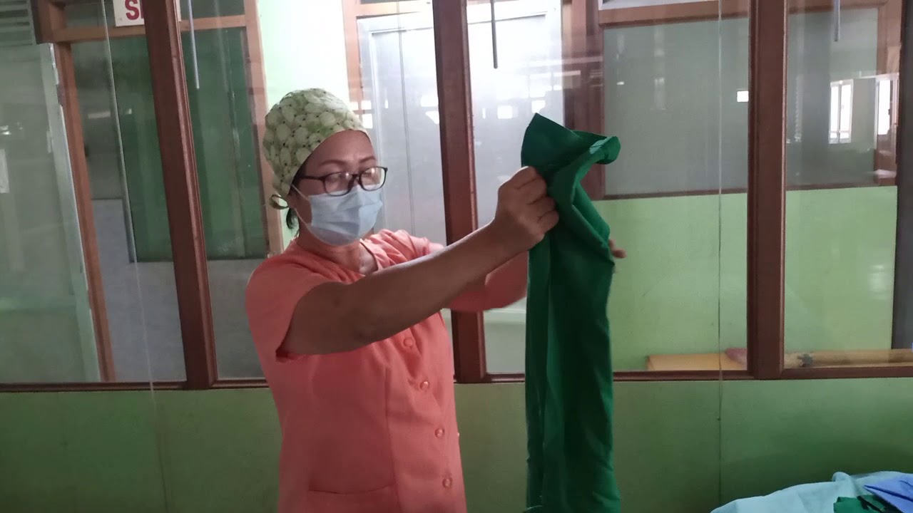 DONNING A STERILE GOWN