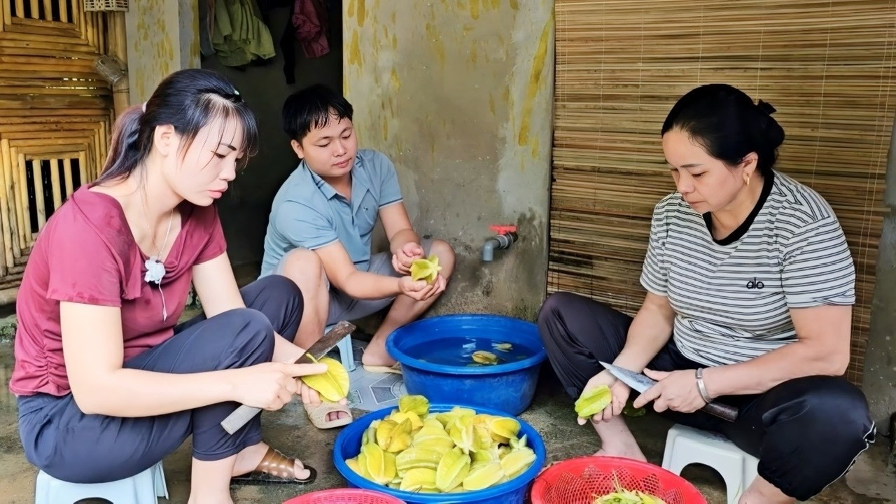 The whole family is making salted starfruit together to store for the winter