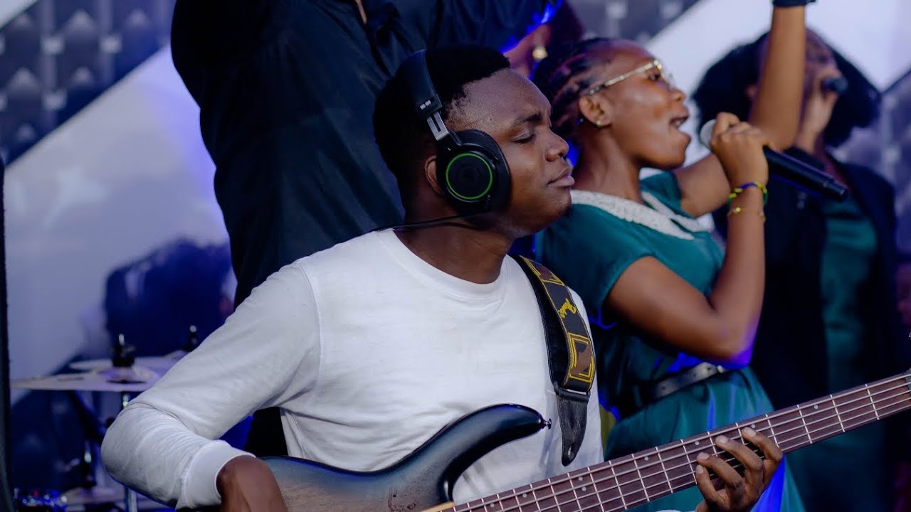 Pbass50 playing we lift your name high at church service.