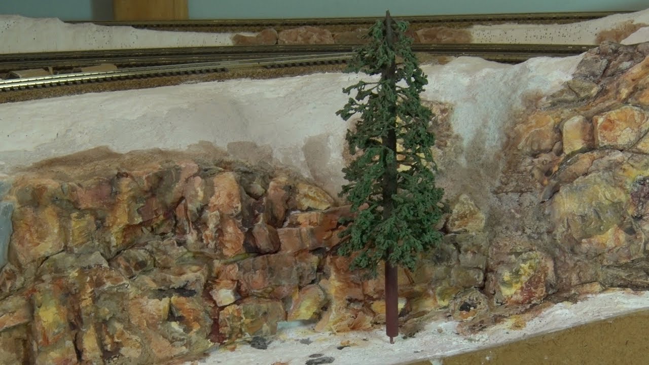 Painting plaster rocks with washes.