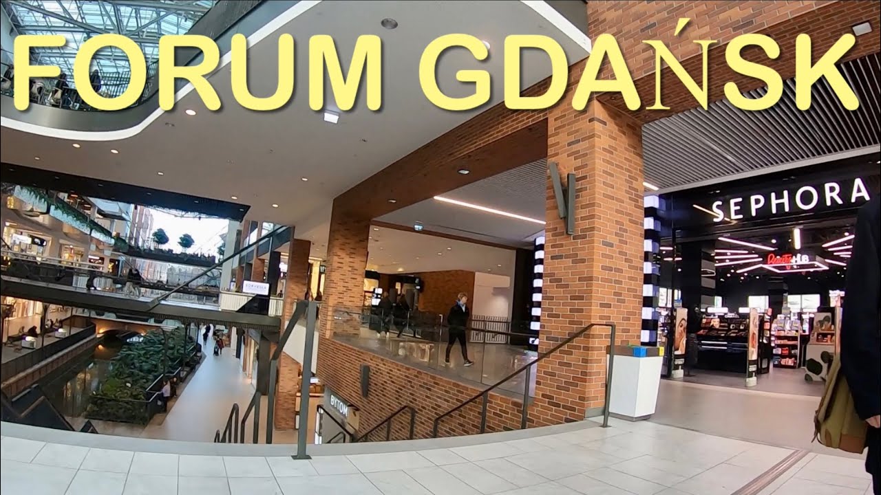 Walking in Forum Gdańsk shopping center. Poland.