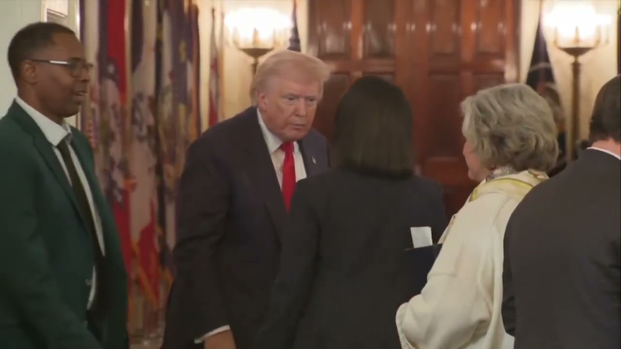 Trump, Condoleezza Rice and Susie Wiles shake hands and walk off together after White House event