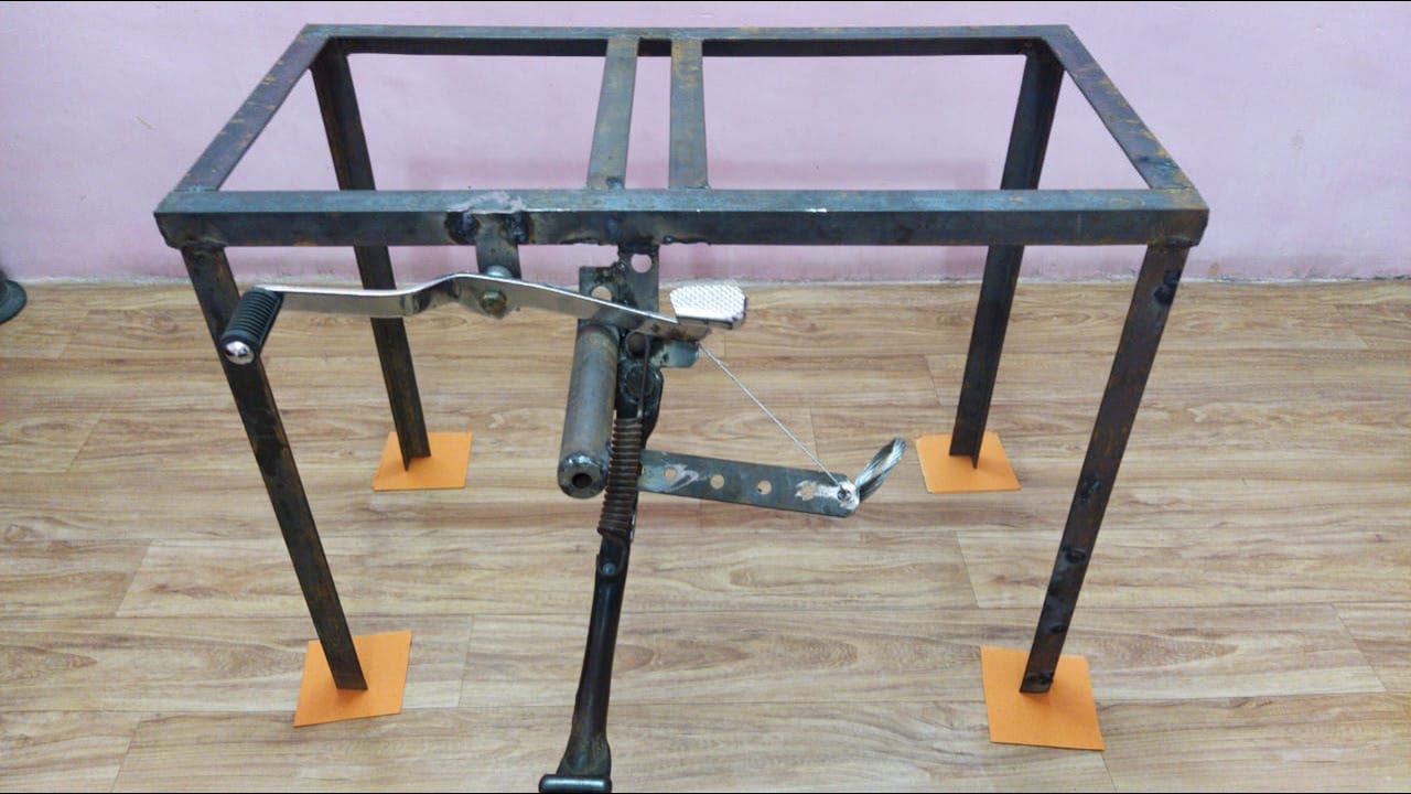 Semi automatic side stand lifting mechanism of a bike