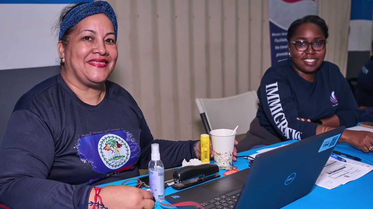 Multi department teams support Immigration Ministry mobile hub in Belize City