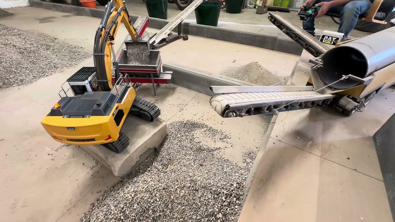 Xd 945 clearing clean sorted stone from the trommel.