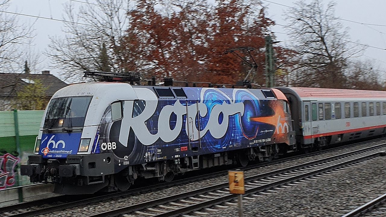 Zugverkehr in Gronsdorf (LK München): Mit ÖBB-Roco-Werbelok Reihe 1116 und Lokomotion Baureihe 189