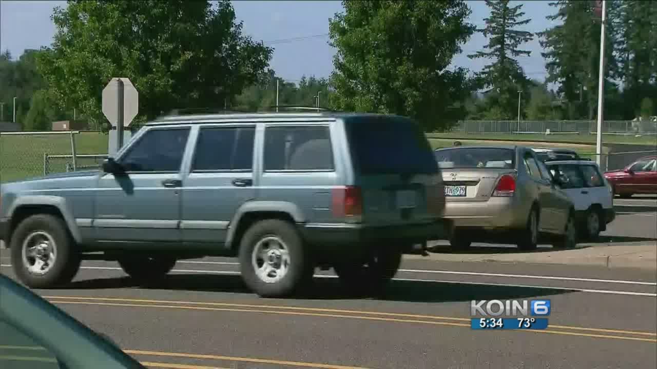 Neighbors worry about safety at high school parking lot