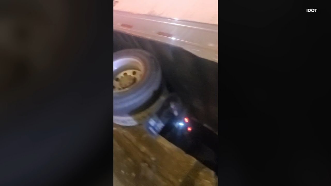 Truck hangs from expressway overpass in Chicago suburbs