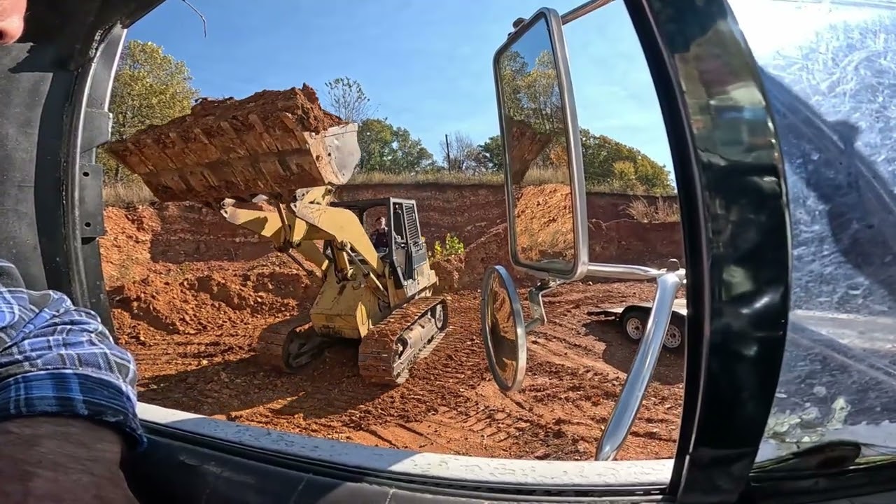 Saving house from landslide, hauling in some good dirt