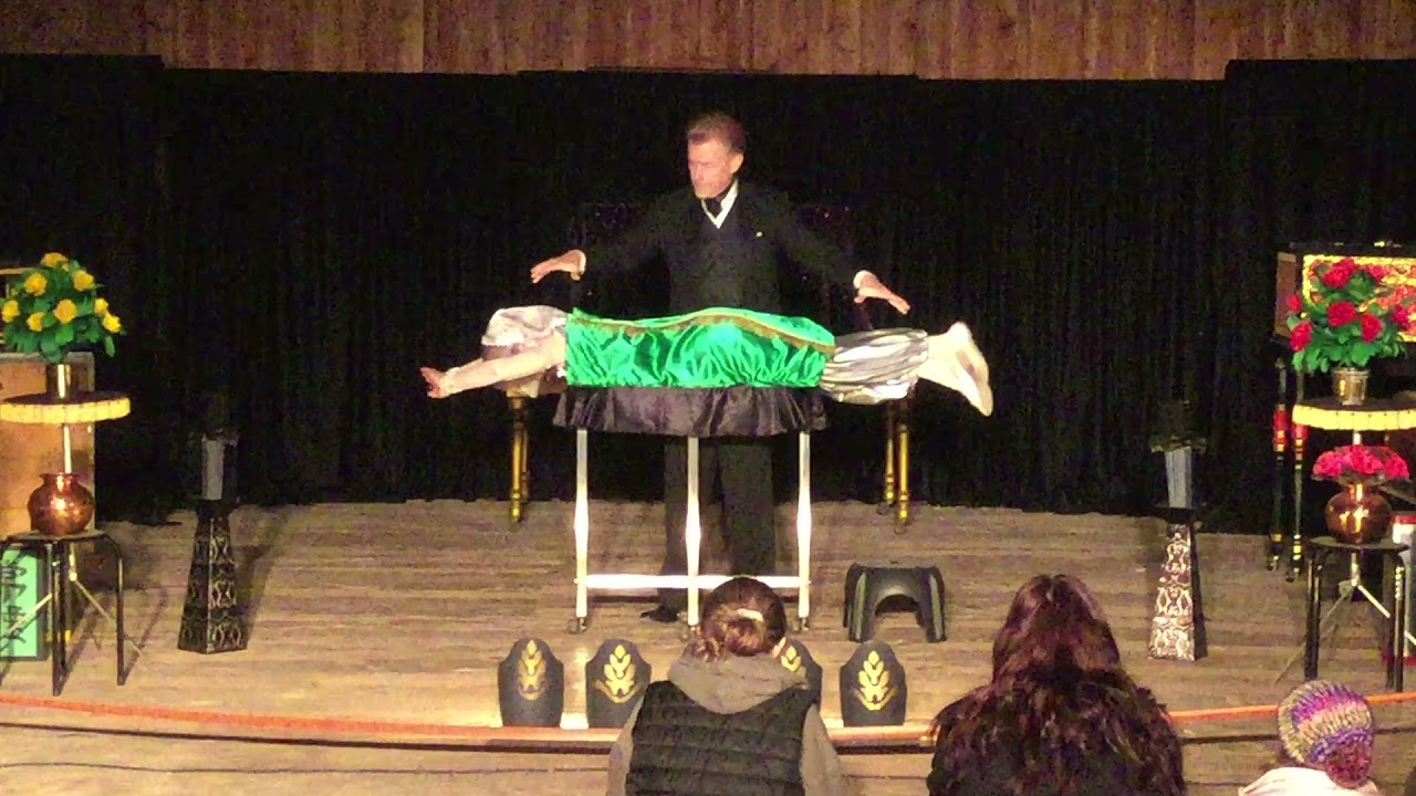 Baffling Bill Levitates Assistant Wrapped in Magic Carpet