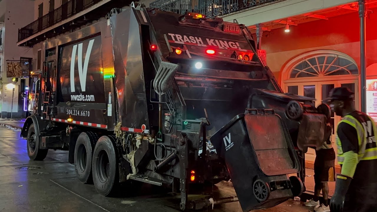 IV Waste Rear Loader Garbage Truck Packing Heavy Wet Trash on Bourbon St