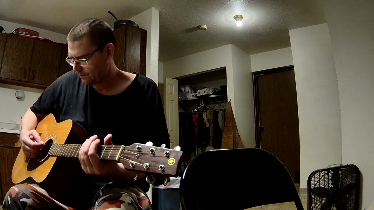 Axe Vladtra playing with guitar