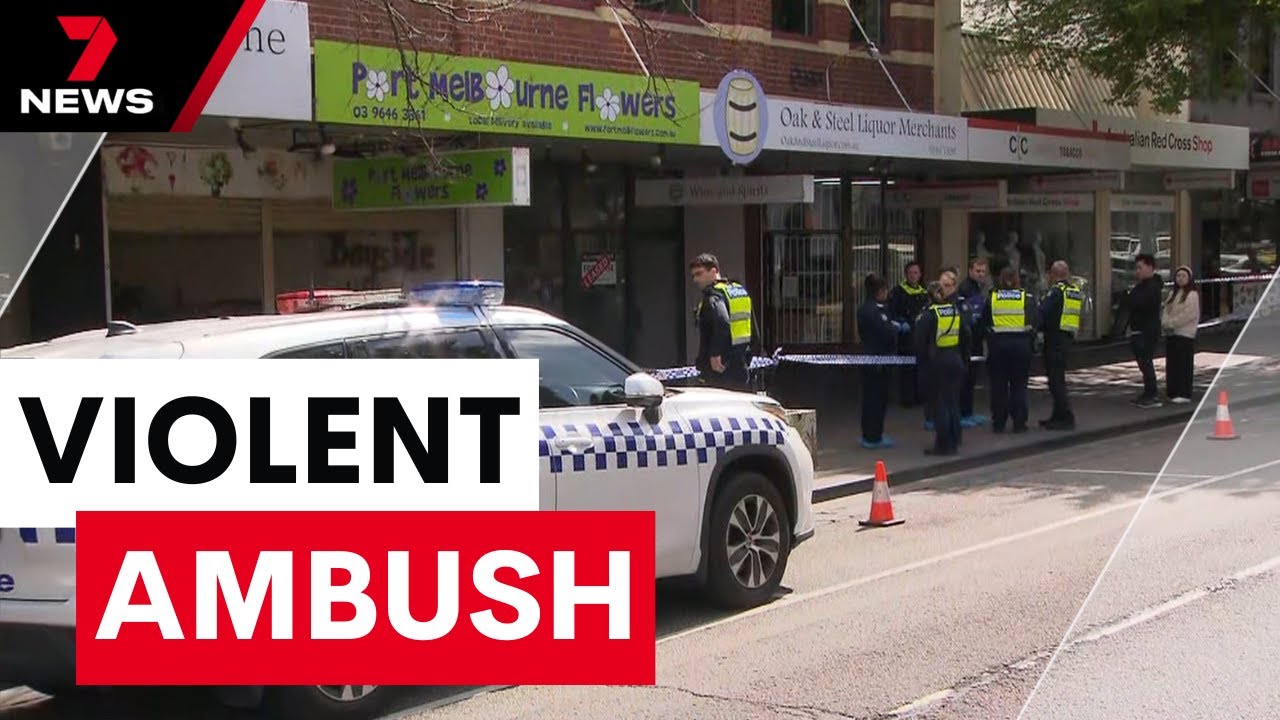 Shopkeeper stabbed in random attack at Port Melbourne - Police hunting for suspect | 7NEWS
