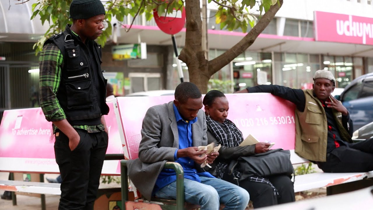 Thieves robbing a man