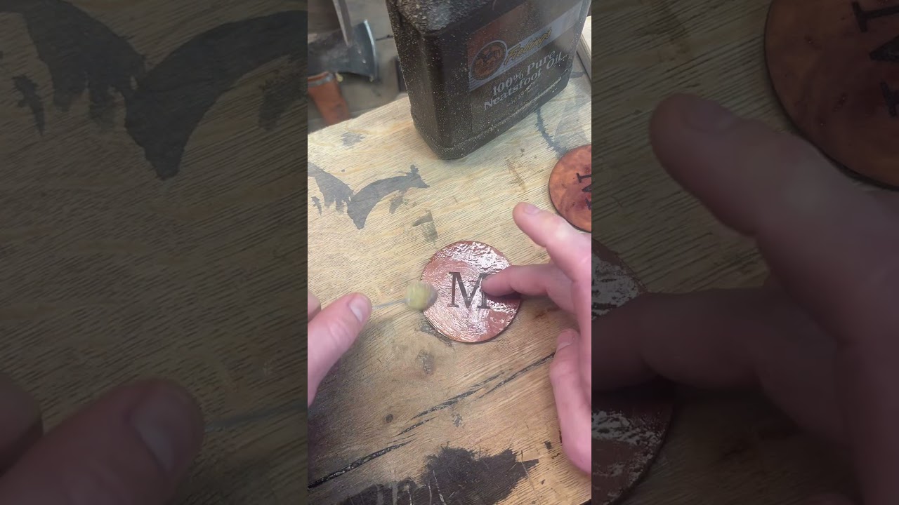 Oiling a set of laser engraved coasters 