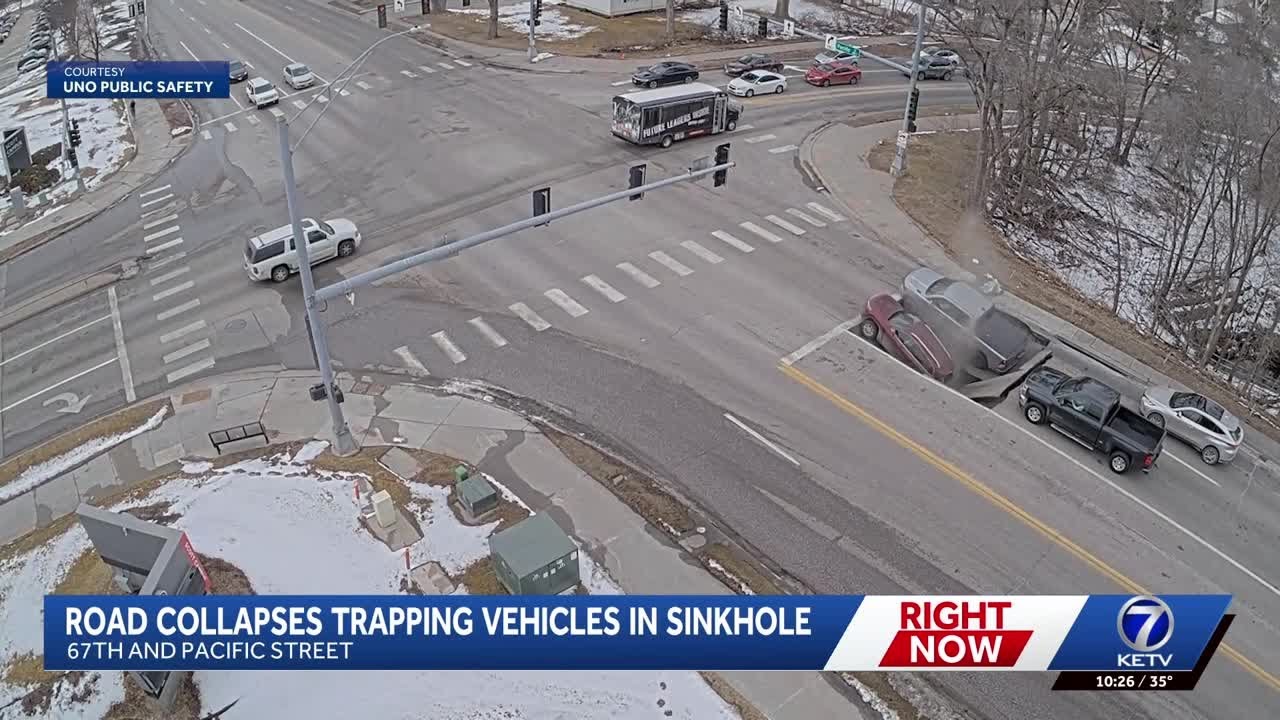Two vehicles stuck in sinkhole near Aksarben after road 'collapsed,' Omaha police say