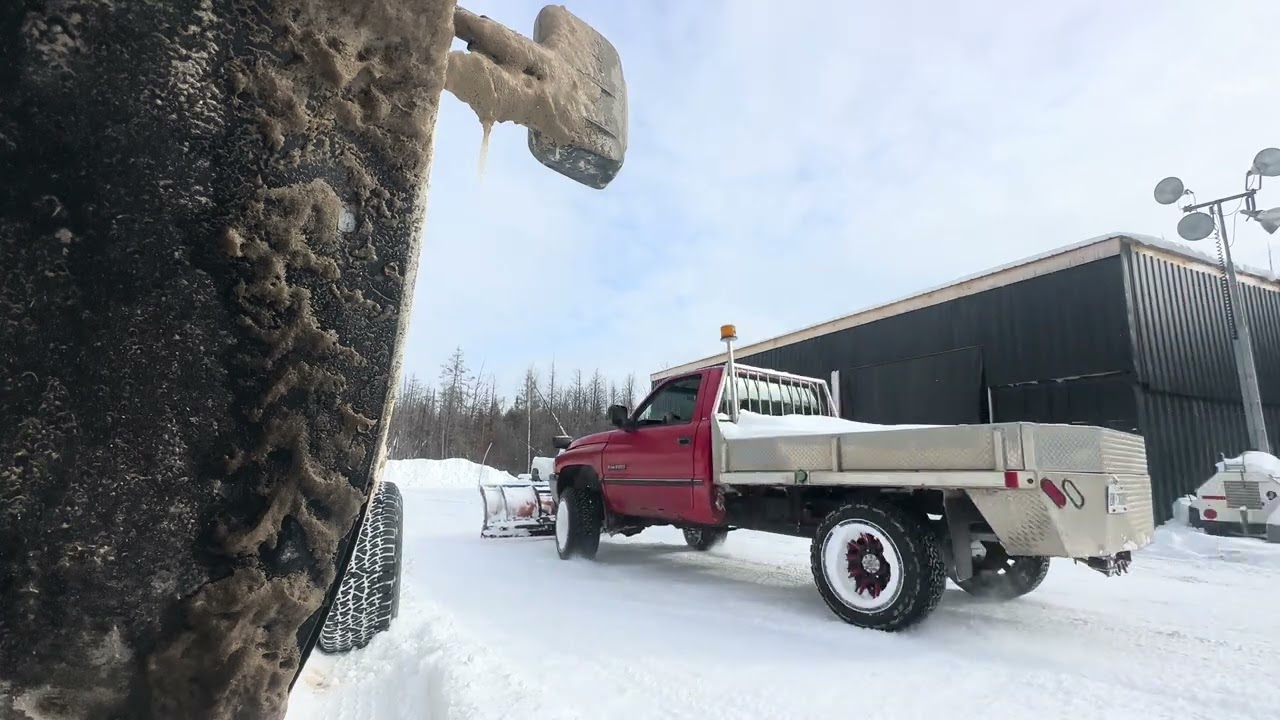 Dodge 12 valve Cummins 2500 straight pipe exhaust snow plowing around garage 