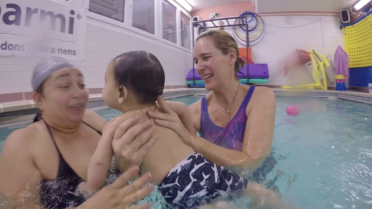 HAPPY  BABY SWIM IN THE WATER