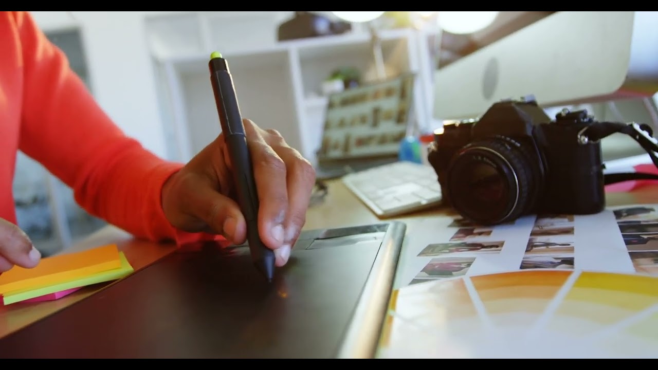 Fashion Designer Using Graphic Tablet: Creative Design Process in Office | WaveBreak Media