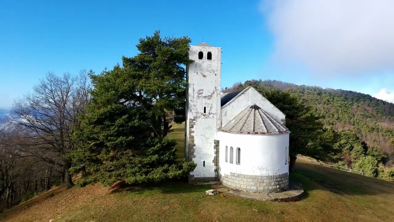 Ancient Mountain Church atop Monte Bignone in the Italian Alps - 4K Aerial Drone View