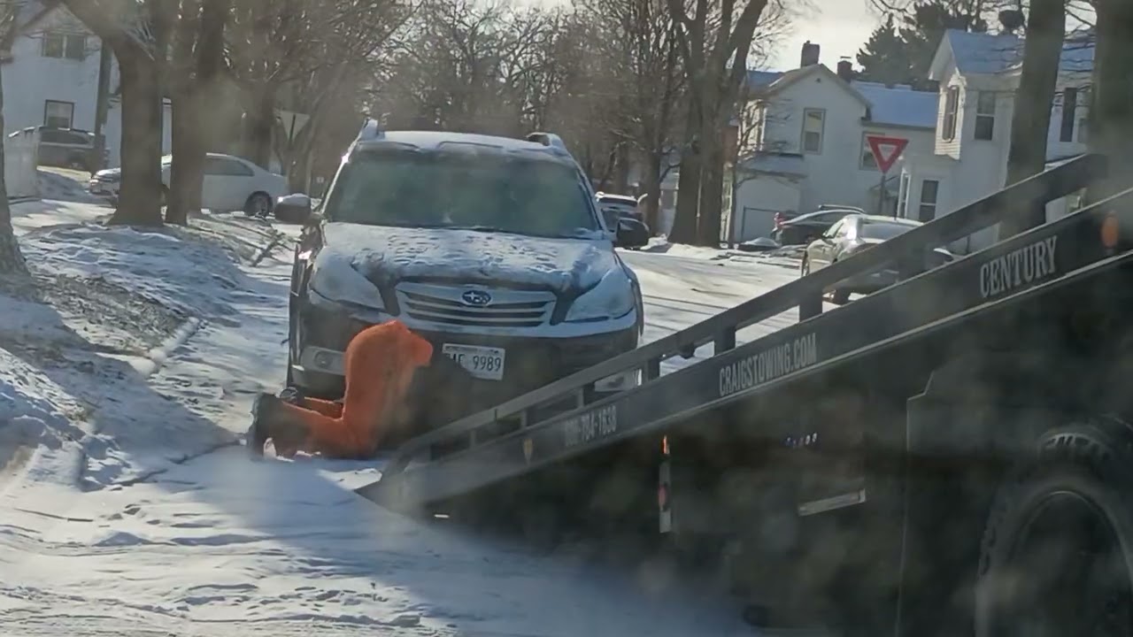 Looks like one of my neighbor's cars are being towed away... (1/10/2026)