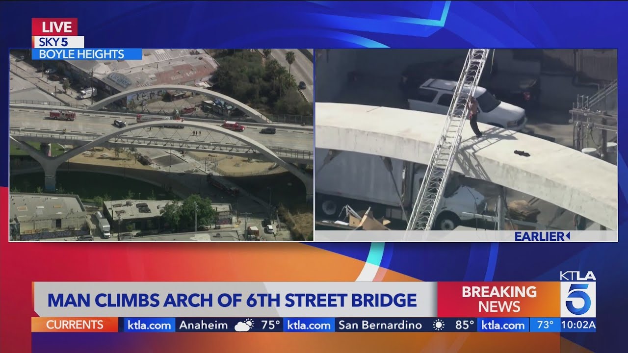 Man climbs arch of 6th Street Bridge, refuses to come down