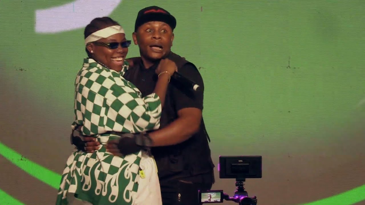 Teni pulls celebrity cameraman Chixon on stage as she performs Power Rangers.