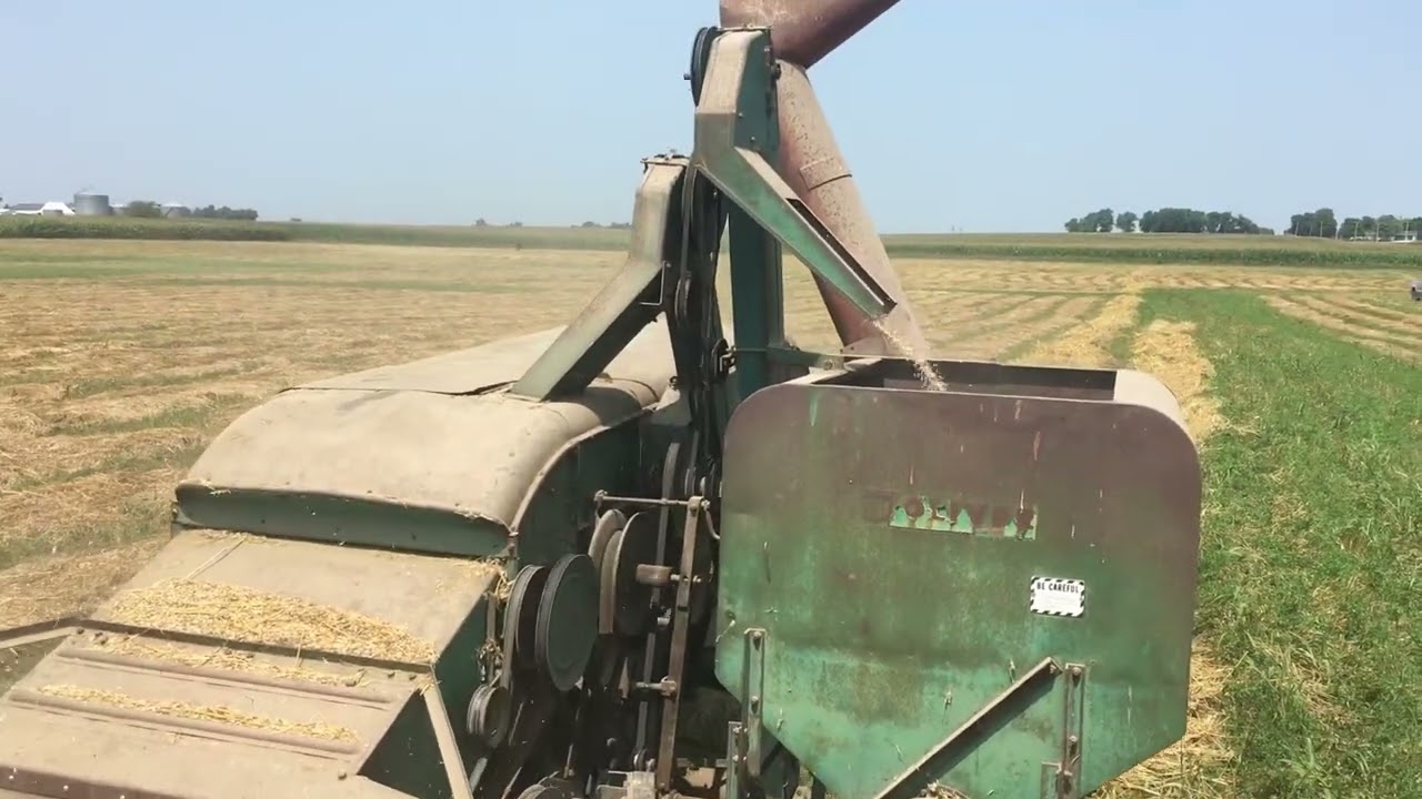 1965 Oliver 770 combining Oats with a 1960 Oliver model 18 Combine with Pick-up attachment