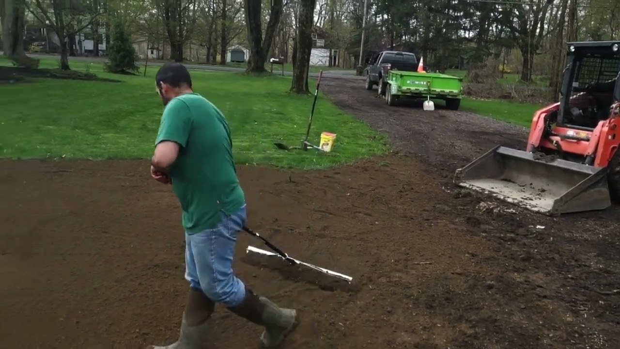 Spreading screened topsoil landscape job