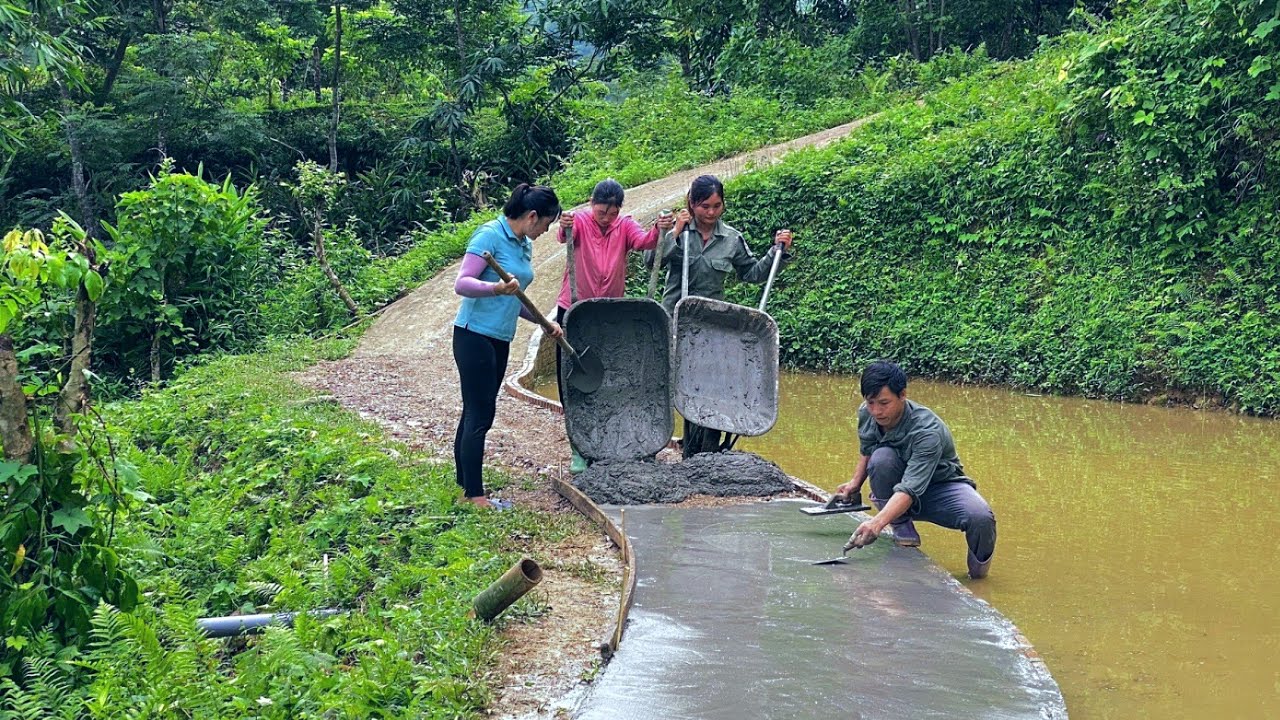 The villagers came to help DAU & TU complete the entire solid road. Coping with stormy season