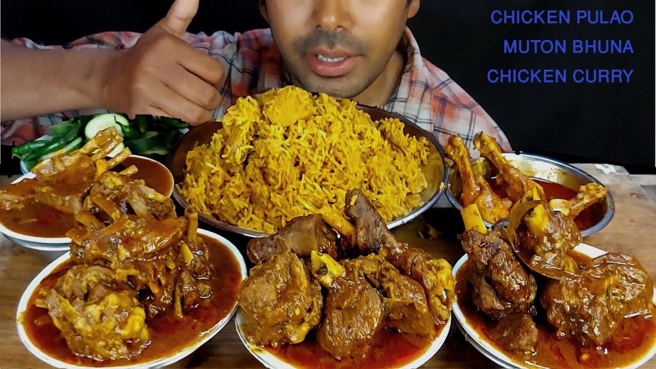 village style chicken biryani and spicy mutton kosha eating with salad green chilli