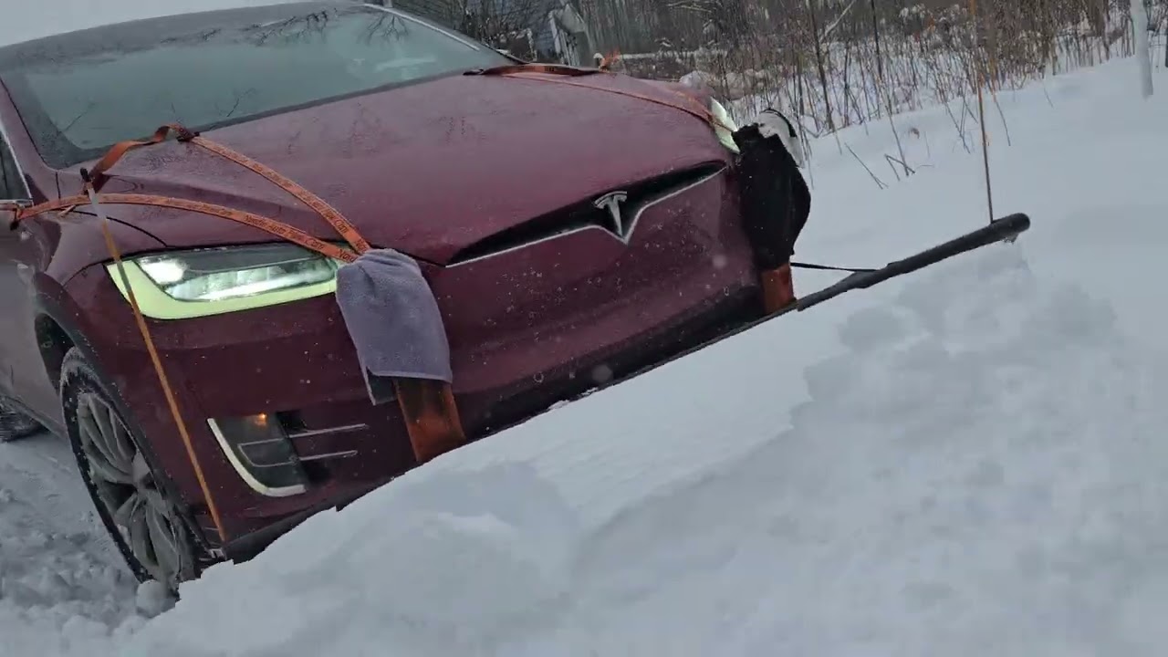 Nordic plow on Tesla model X snow plowing