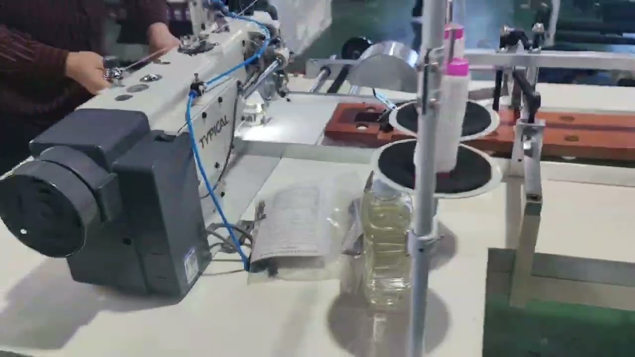 Center Saddle Thread Sewing and Outward Folding Machine