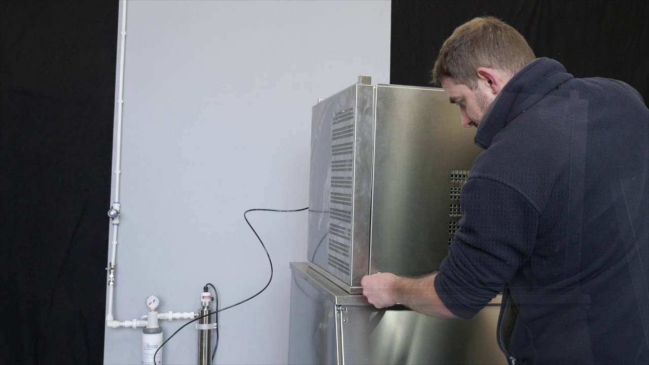 Installing a small machine onto a slope fronted bin