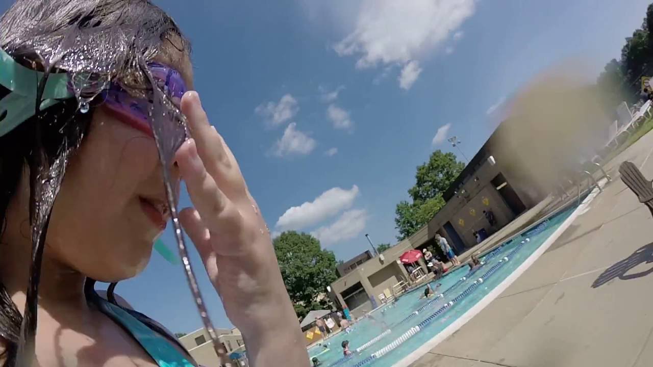 Handheld GoPro jumping in the pool