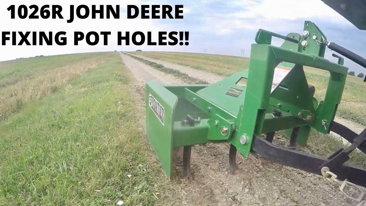 John Deere 1025R Fixing the Pot Holes w/ Box Blade