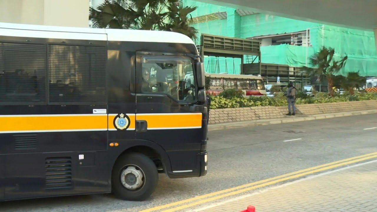 Police vans arrive at court ahead of media tycoon Jimmy Lai sentencing | AFP