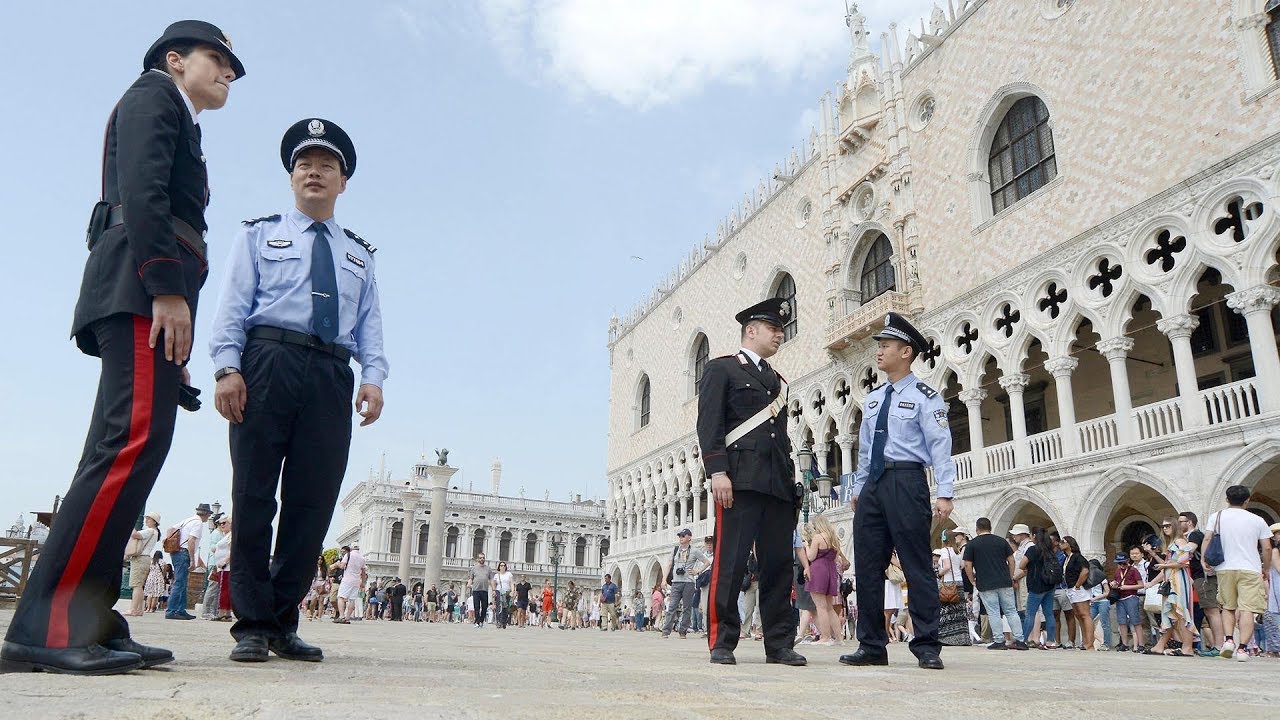 Chinese officers patrol with Italian counterparts as part of security cooperation project