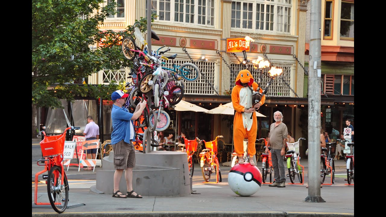 Charmander Plays Pok&eacute;mon Theme on Flaming Bagpipes while Balancing on a Pok&eacute;ball in Portland