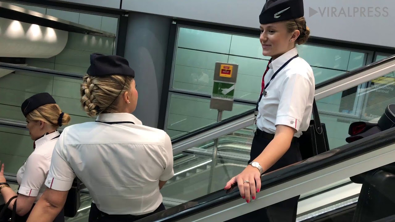 British Airways Cabin Crew On Escalator