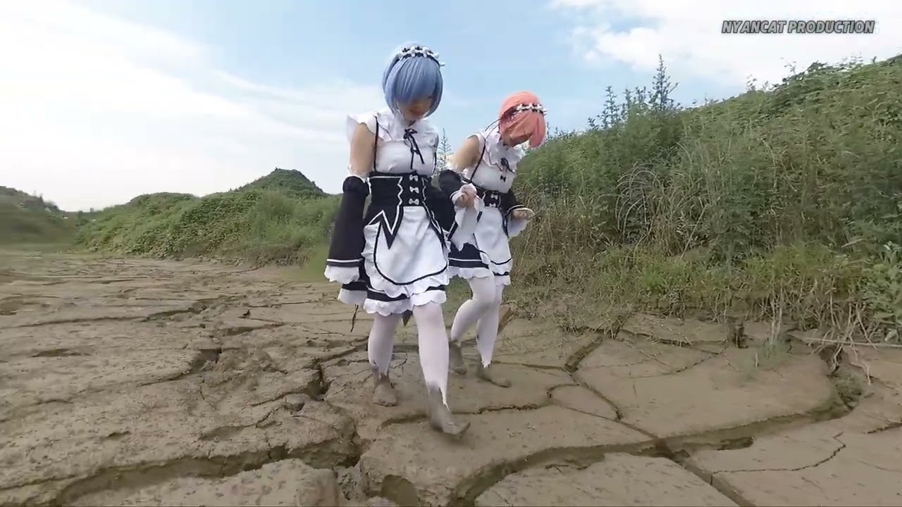 Two cosplaying girls stomping in the mud