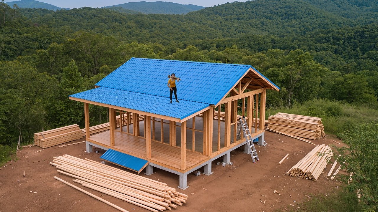 The young woman spent 125 days building her magnificent dream log cabin in the forest.