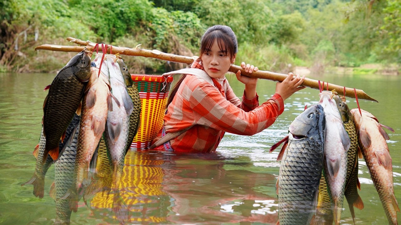 A 17-year-old single mother catches fish by hand. Building a life in the lush green mountains