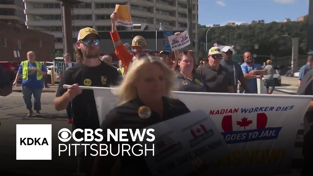 Union leaders and workers march through Downtown Pittsburgh