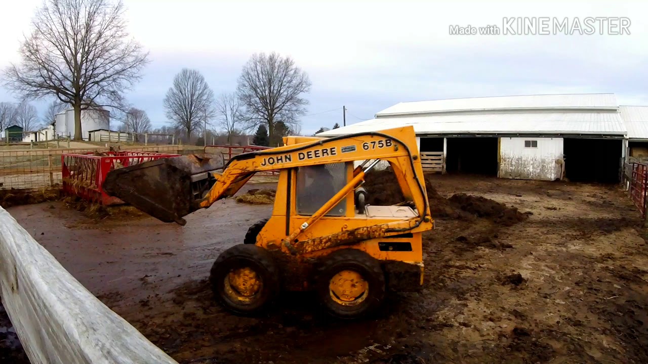 John Deere 675B skidsteer hard at work!
